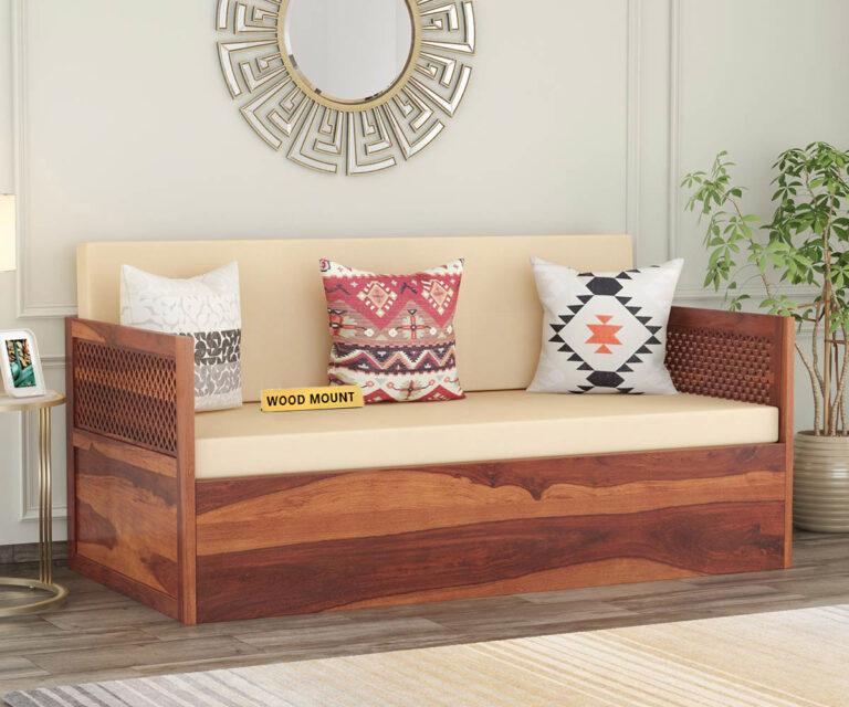 Elegant solid wood sofa cum bed with plush cushions, sturdy frame, and space-saving design by wood mount