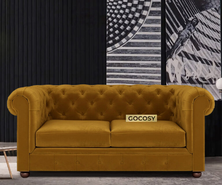 Luxurious Hunyadi Yellow Velvate Chesterfield sofa with deep button tufting, rolled arms, and nailhead trim, adding a classic touch to a living room.