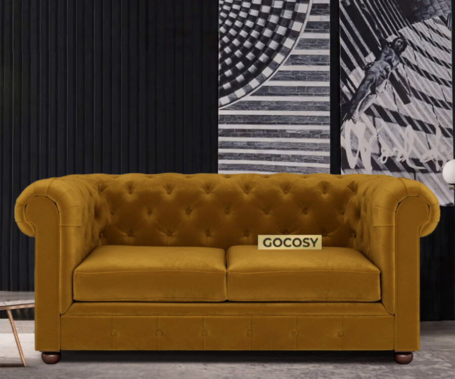 Luxurious Hunyadi Yellow Velvate Chesterfield sofa with deep button tufting, rolled arms, and nailhead trim, adding a classic touch to a living room.