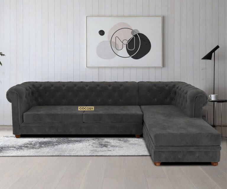 Luxurious Payne's Grey Velvet Chesterfield sofa with deep button tufting, rolled arms, and nailhead trim, adding a classic touch to a living room.