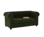 Luxurious Dark Forest Green Chesterfield sofa with deep button tufting, rolled arms, and nailhead trim, adding a classic touch to a living room.
