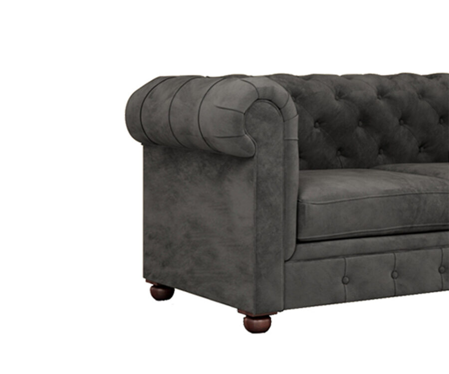 Luxurious Payne's Grey Velvate Chesterfield sofa with deep button tufting, rolled arms, and nailhead trim, adding a classic touch to a living room.