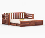 Elegant solid wood sofa cum bed with plush cushions, sturdy frame, and space-saving design by wood mount