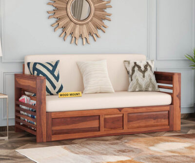 Elegant solid wood sofa cum bed with plush cushions, sturdy frame, and space-saving design by wood mount