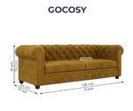 Luxurious Hunyadi Yellow Velvate Chesterfield sofa with deep button tufting, rolled arms, and nailhead trim, adding a classic touch to a living room.