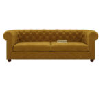 Luxurious Hunyadi Yellow Velvate Chesterfield sofa with deep button tufting, rolled arms, and nailhead trim, adding a classic touch to a living room.