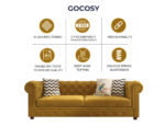 Luxurious Hunyadi Yellow Velvate Chesterfield sofa with deep button tufting, rolled arms, and nailhead trim, adding a classic touch to a living room.