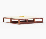 Elegant solid wood sofa cum bed with plush cushions, sturdy frame, and space-saving design by wood mount