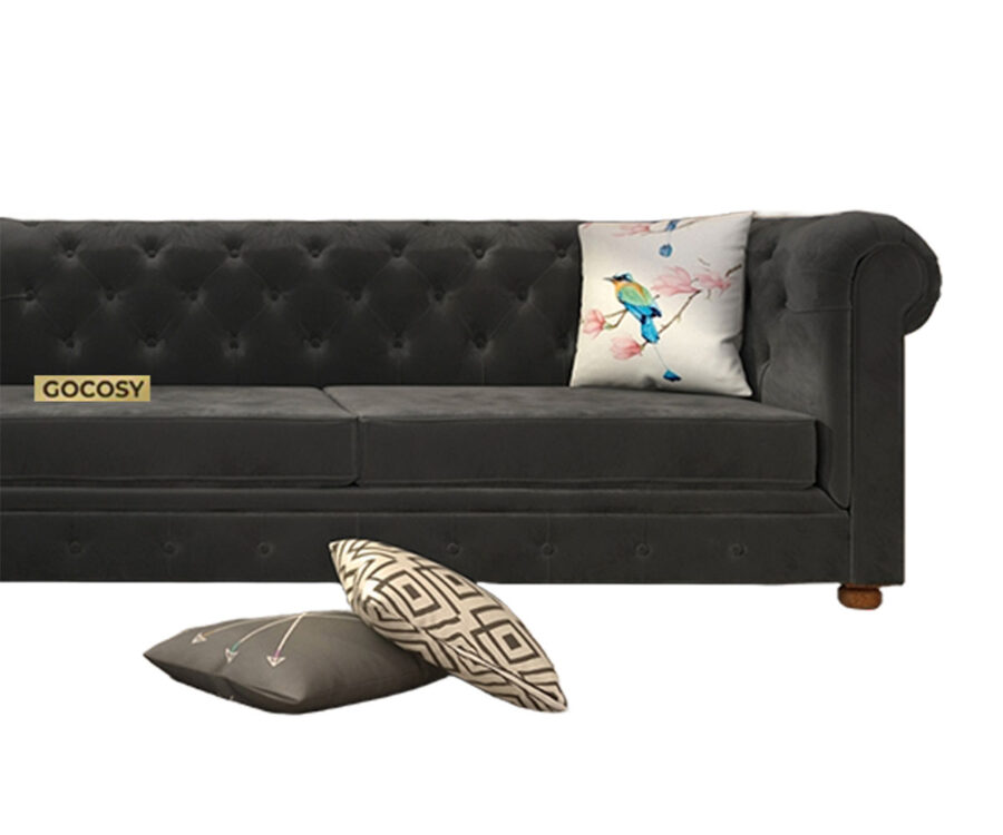 Luxurious Payne's Grey Velvet Chesterfield sofa with deep button tufting, rolled arms, and nailhead trim, adding a classic touch to a living room.