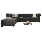 Luxurious Payne's Grey Velvet Chesterfield sofa with deep button tufting, rolled arms, and nailhead trim, adding a classic touch to a living room.