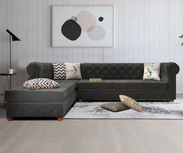 Luxurious Payne's Grey Velvet Chesterfield sofa with deep button tufting, rolled arms, and nailhead trim, adding a classic touch to a living room.